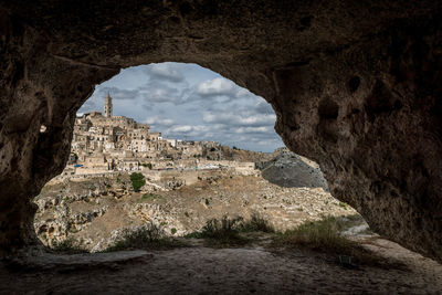 Buildings seen through arch at sassi di matera