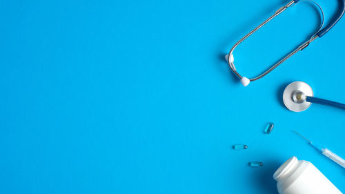 High angle view of blue metal over white background