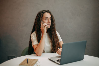 Young girl working at home