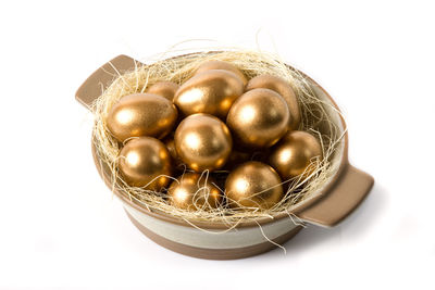 High angle view of eggs in container against white background