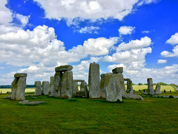 Built structure on field against sky