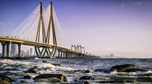 Bandra–worli sea link over sea against clear sky