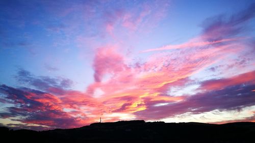 Low angle view of dramatic sky during sunset