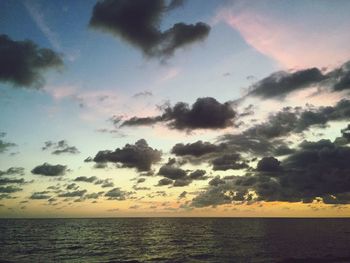 Scenic view of calm sea at sunset