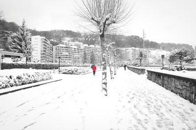 Man walking on snow covered landscape