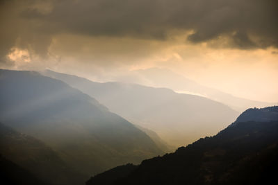 Scenic view of mountains against sky during sunset