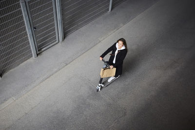 High angle view of man walking on road