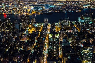 Aerial view of illuminated cityscape at night