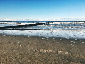 Scenic view of beach against sky