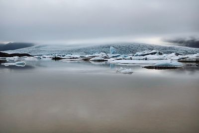 Scenic view of frozen sea against sky