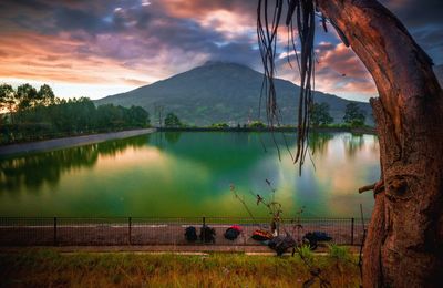 Scenic view of lake against sky during sunset