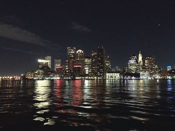 Illuminated city at waterfront