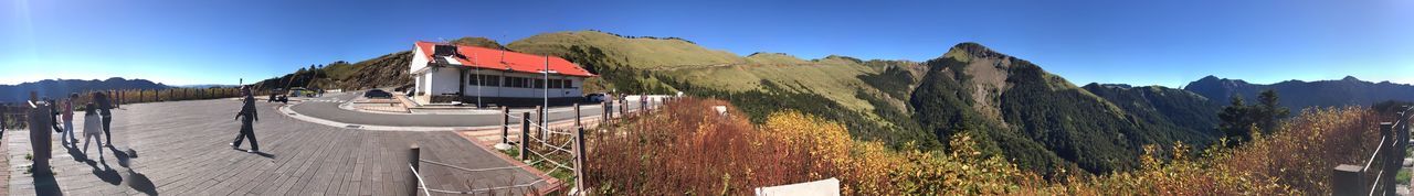 Panoramic view of mountains against clear blue sky