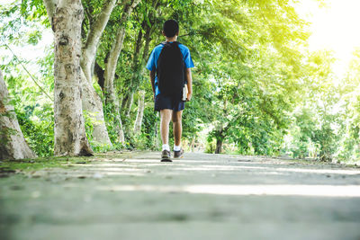 Asian boy student walking on street back to school in the morning