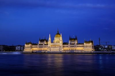 Illuminated city at waterfront