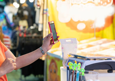 Hand and mobile payment in street food ,mobile payment concept