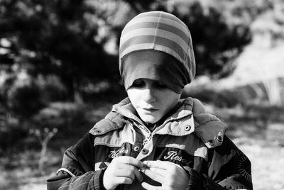 Boy wearing warm clothing on field