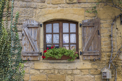 Low angle view of window on old building