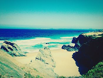 Scenic view of sea against blue sky