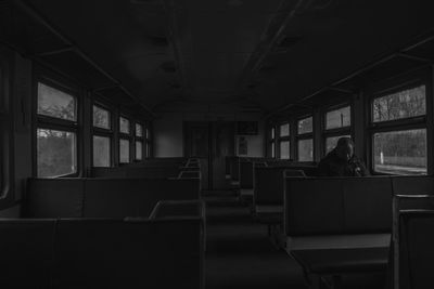 Rear view of man sitting in bus