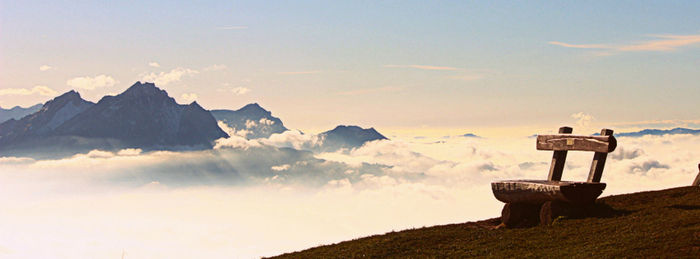 Scenic view of mountains against cloudy sky