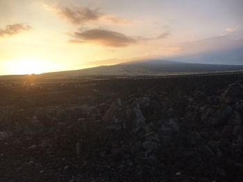 Scenic view of landscape against sky during sunset