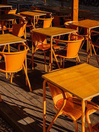 Empty chairs and tables in cafe
