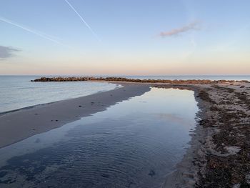 Scenic view of sea against sky during sunset