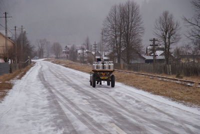 Horse cart on snow covered street