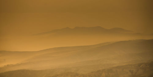 Scenic view of mountains during sunset