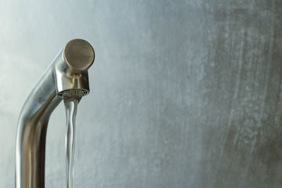 Close-up of water faucet in bathroom