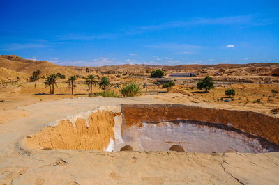 View of desert against blue sky