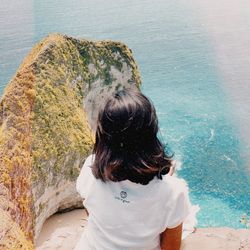 Rear view of woman looking at sea