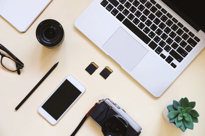 High angle view of digital camera on table