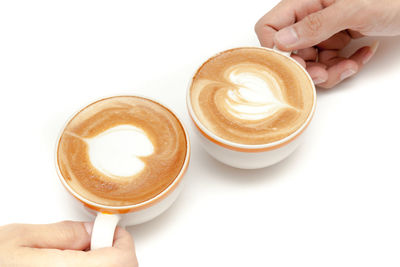 Hand holding coffee cup