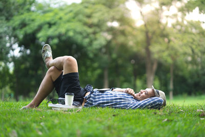 Full length of man lying on field