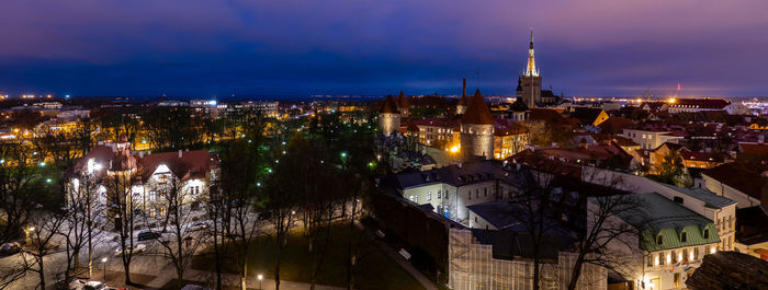 High angle view of illuminated buildings in city at night