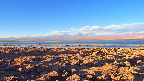 Scenic view of lake against sky during winter