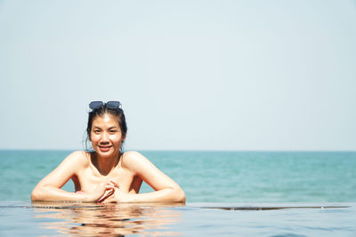 Portrait of woman swimming in sea