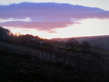 Scenic view of landscape against sky during sunset