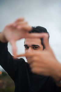 Portrait of young man gesturing