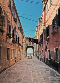 Narrow alley amidst buildings in city