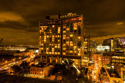 High angle view of city lit up at night