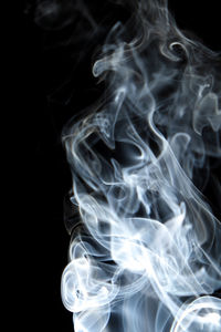 Close-up of smoke against black background