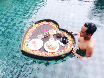 High angle view of cake in swimming pool