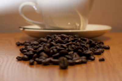 Close-up of coffee beans on table