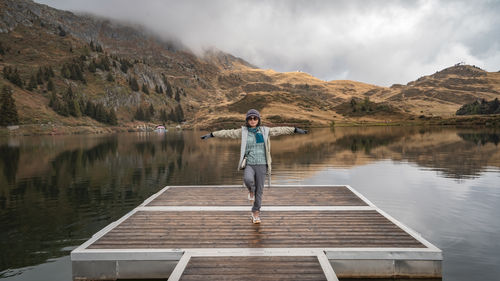 Rear view of man standing in lake