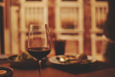 Close-up of wine in glass on table