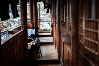 PEOPLE SITTING IN BUILDING