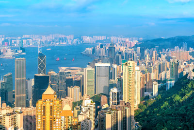 Aerial view of modern buildings in city against sky